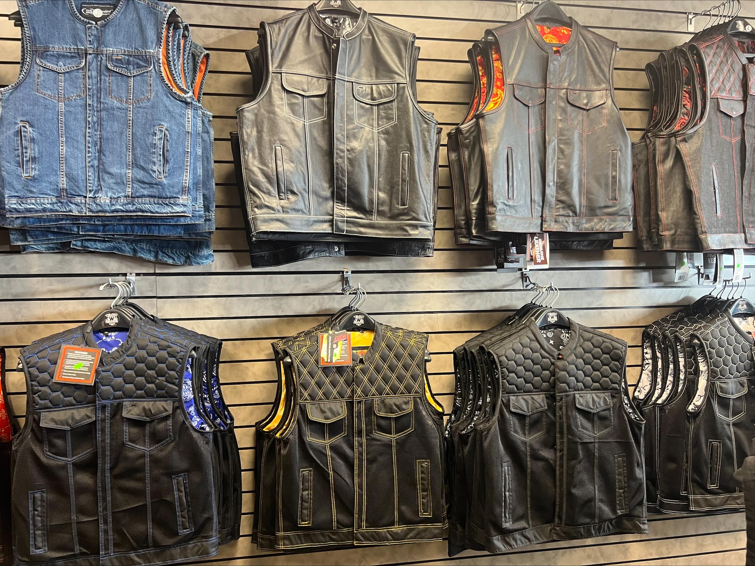 Motorcycle club vests lined up for patch sewing while you wait