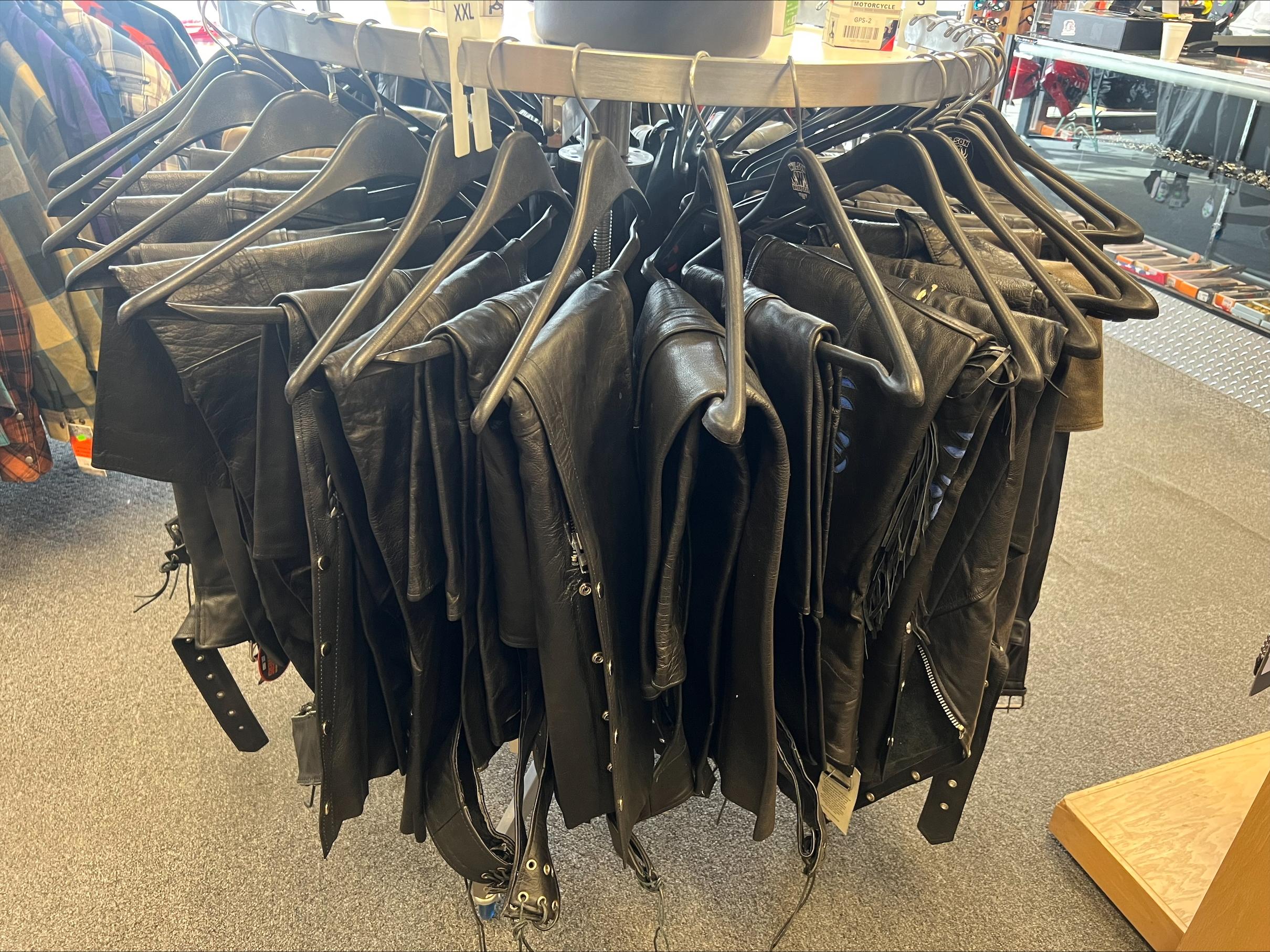 Chaps and riding pants hanging in the shop